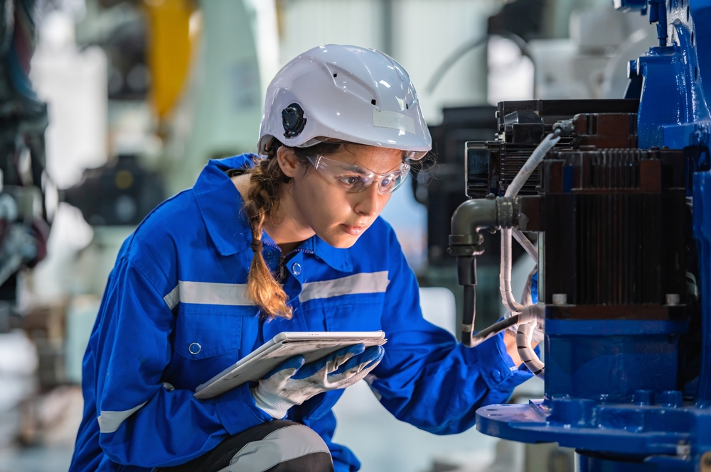 engineer with robotic arm